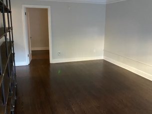 Clean and polished hardwood floors in an empty room after professional service by BellevueCleans — expert construction cleaning services in Bellevue.